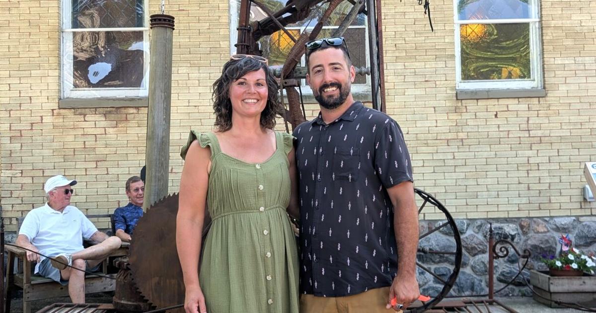 The Lamplighter sculpture, crafted by Ashley and Tyler Voorhees from found materials